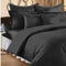 A set of black colored king-size bed sheets with plum stripes, displayed on a bed with pillow covers.