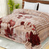 A double bed blanket with a floral pattern in multicolor on a mink background, displayed on a bed.