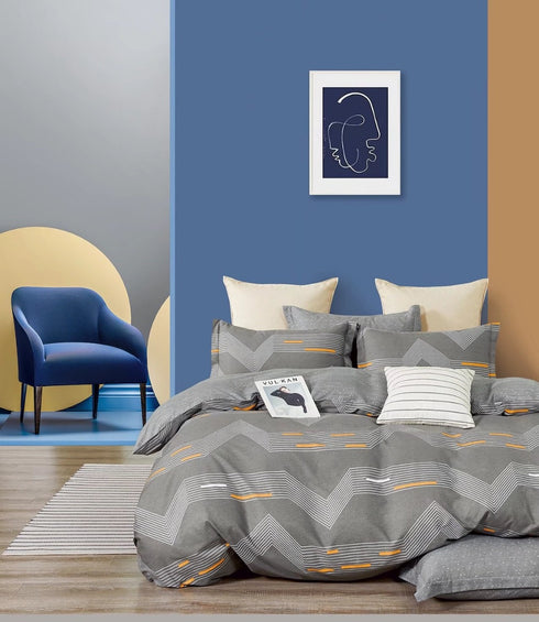 A single bedsheet with pillow covers in a geometric pattern displayed in a home setting