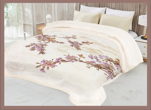 A double bed blanket with a floral printed pattern in off-white color draped on a bed.