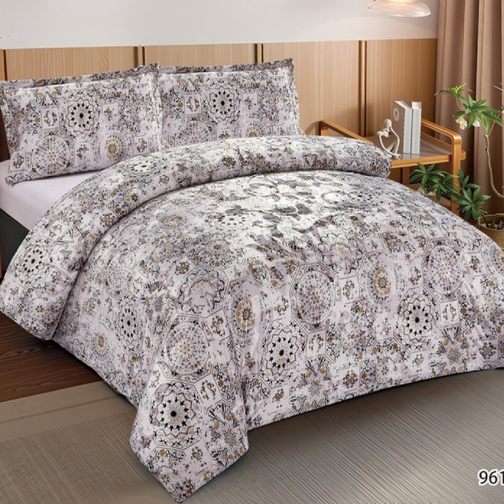 Decorative bedspread with intricate patterns on a bed in a bedroom setting.