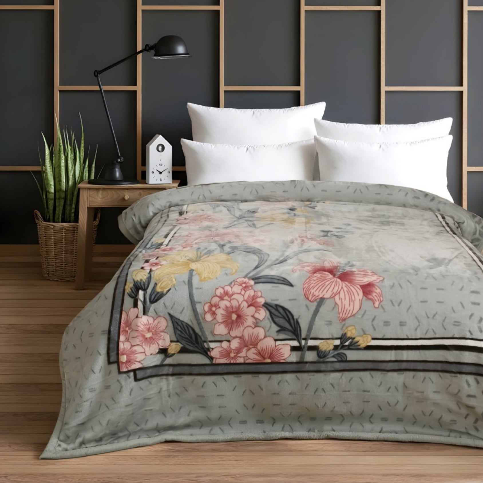 Floral patterned comforter on a bed in a bedroom setting with a dark wall and wooden nightstand.