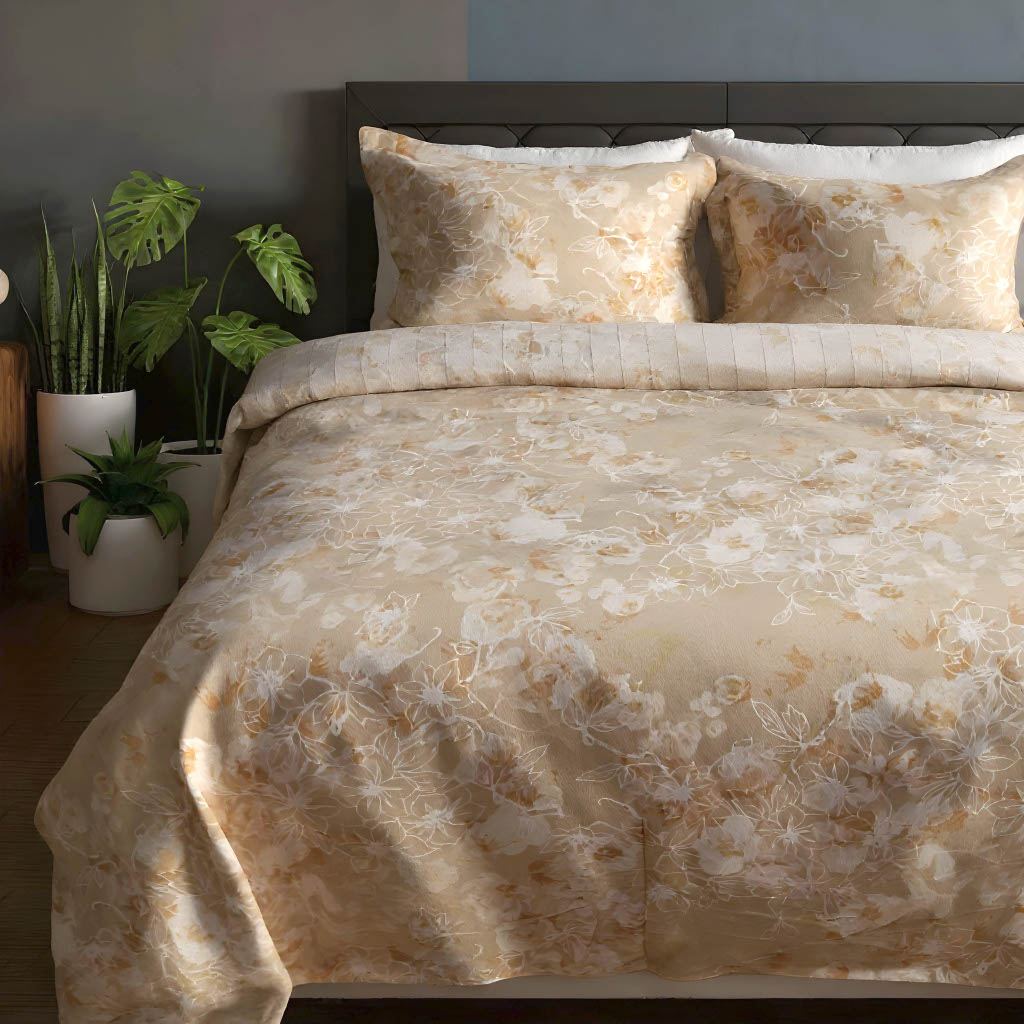 Floral patterned comforter set on a bed with plants in the background