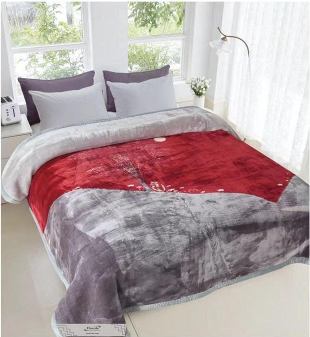 A double bed blanket with a minky texture in gray and red colors, displayed on a bed in a room with a window and decorative pillows.